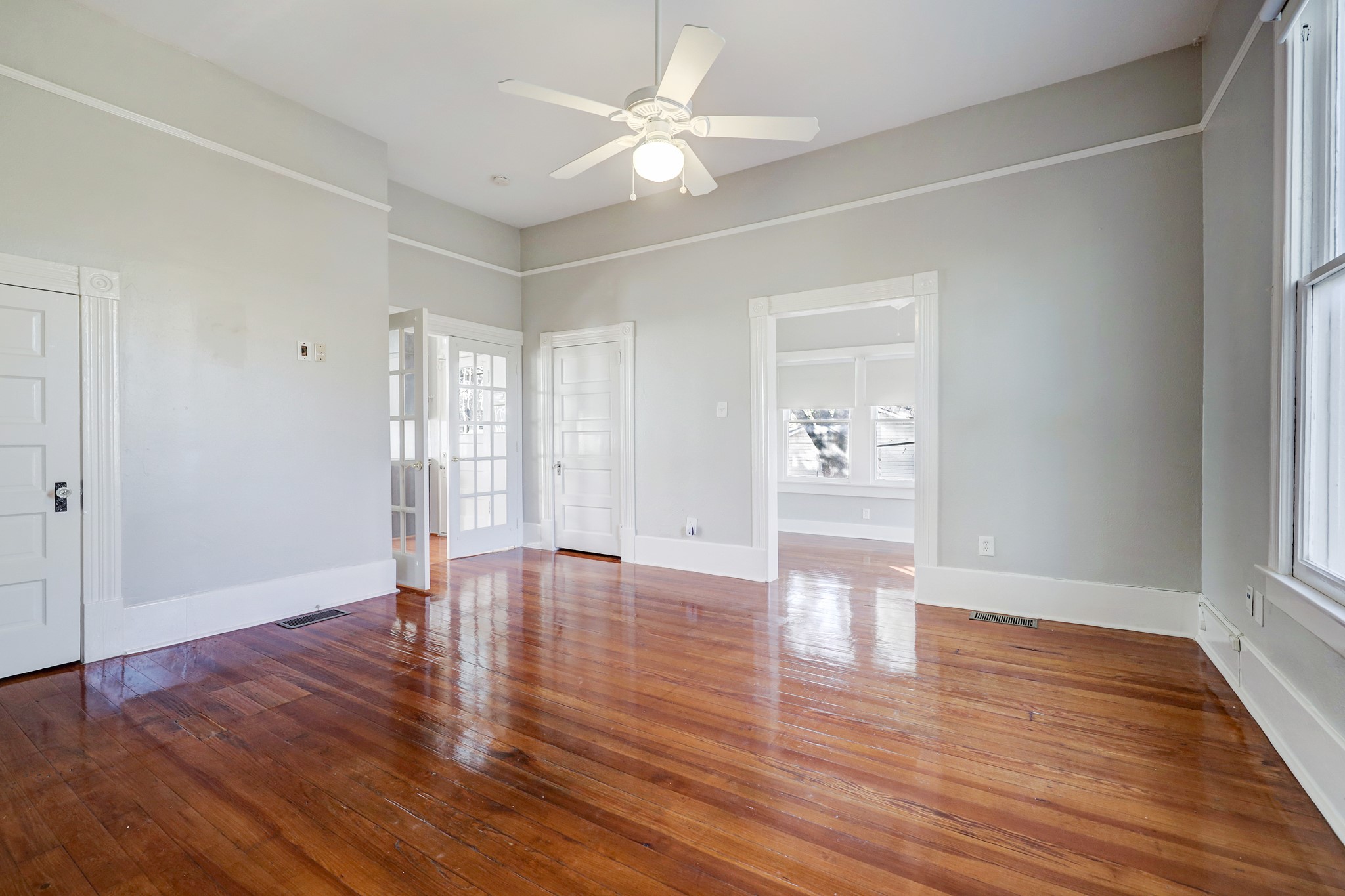 1229 Heights Boulevard Houston, TX 77008 - Photo 15 of 30 a view of an empty room with window and wooden floor