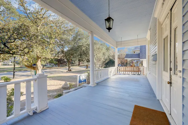 a view of a porch with wooden floor and outdoor space