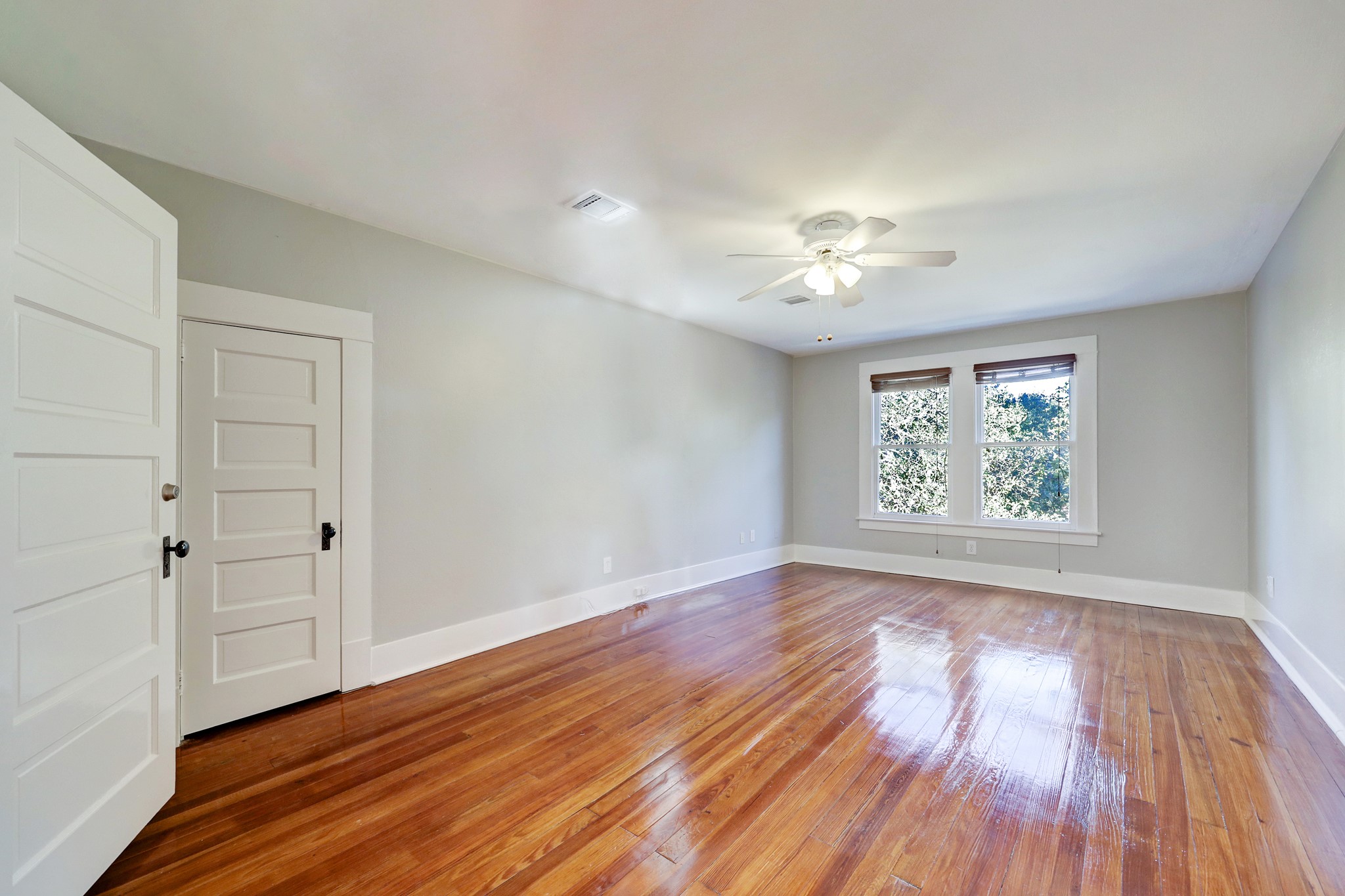 1229 Heights Boulevard Houston, TX 77008 - Photo 24 of 30 wooden floor in an empty room with a window