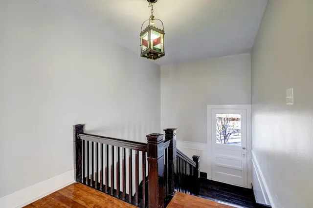 a view of a hallway with windows
