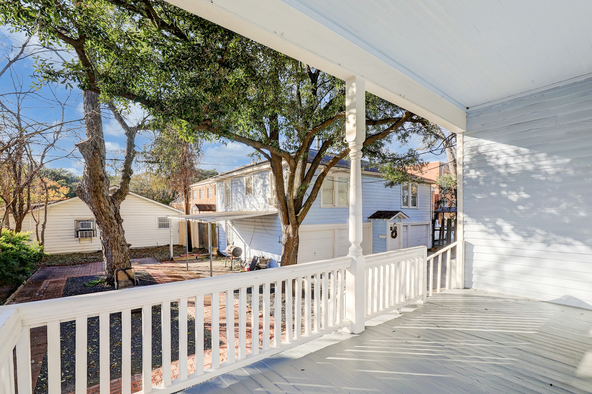 1229 Heights Boulevard Houston, TX 77008 - Photo 26 of 30 a view of a house with a small yard and wooden fence