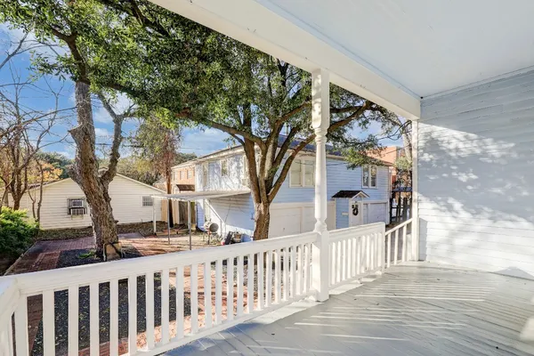 a green field with trees in the background