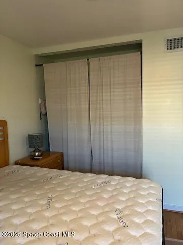 a view of a room with a dresser