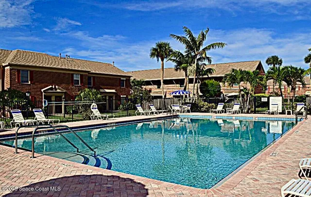 a view of a swimming pool with a patio