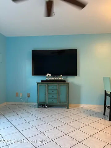 a living room with a couch and a flat screen tv