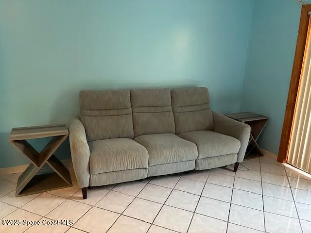 a living room with a couch and a rug