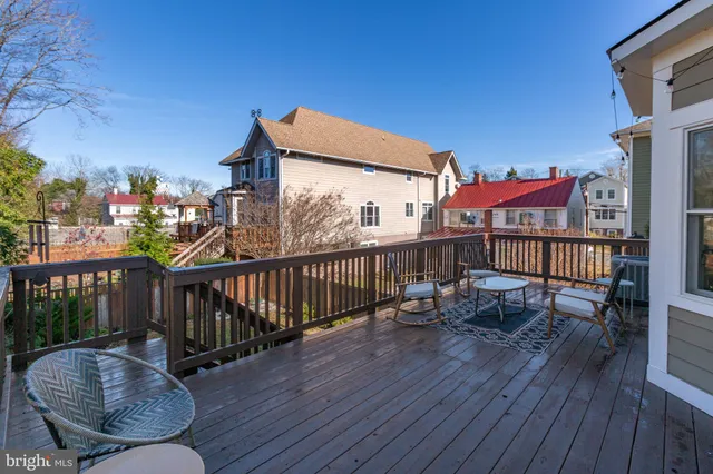 a view of a patio with table and chairs and potted plants