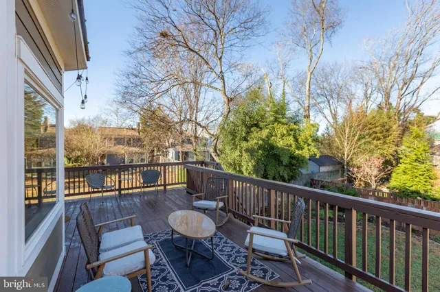 a view of a backyard with wooden fence