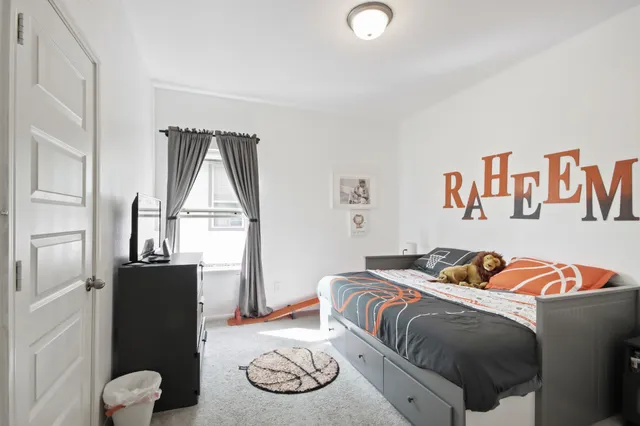 a bathroom with a sink and mirror with toilet