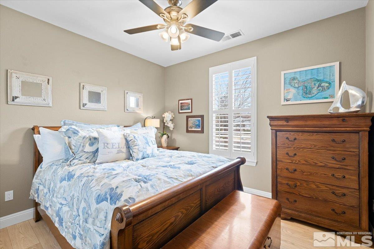 630 Equine Court Reno, NV 89521 - Photo 25 of 40 a bedroom with a bed and a dresser