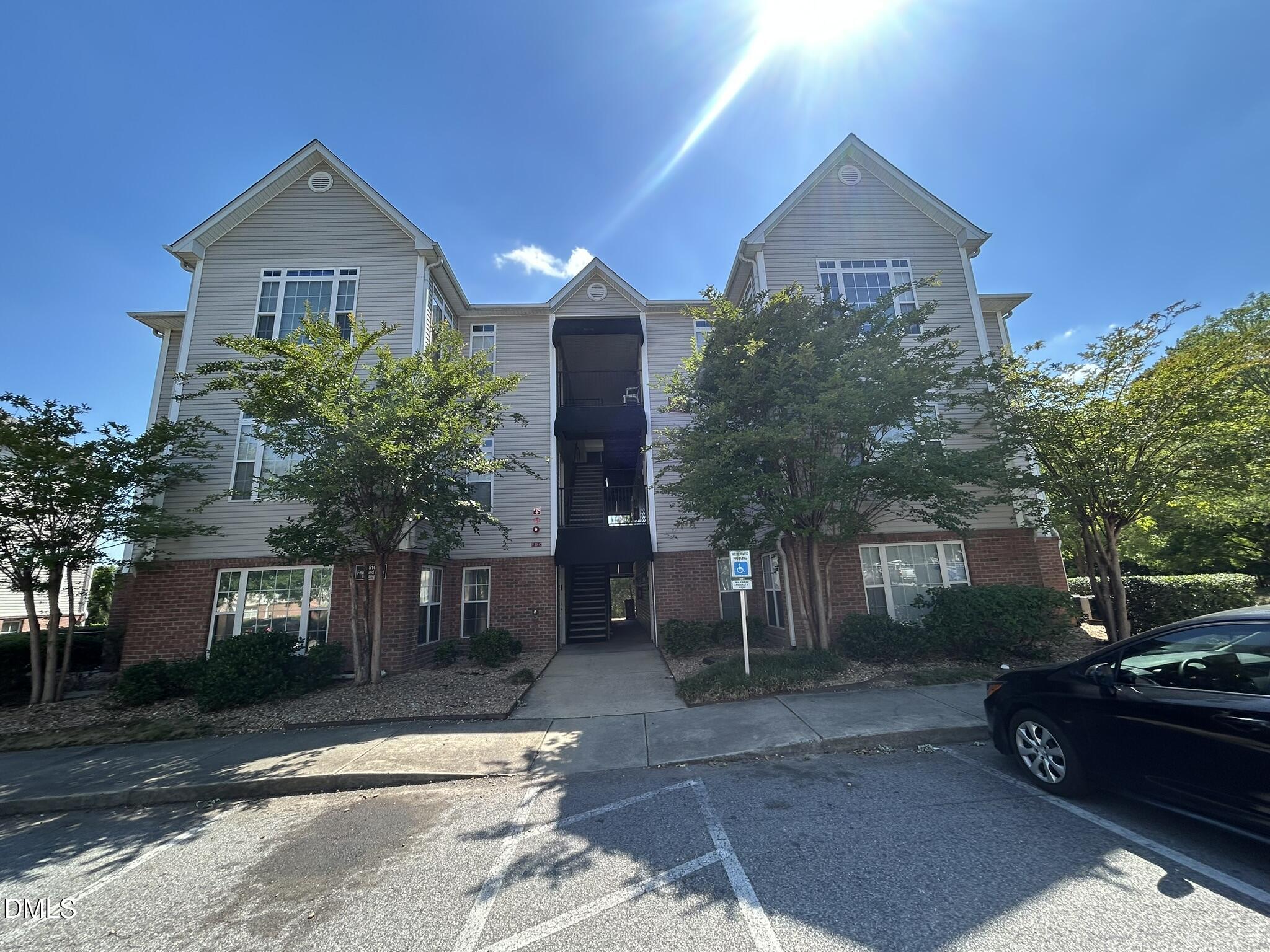 2510 Friedland Place, Unit 102 Raleigh, NC 27617 - Photo 42 of 42 a front view of a house with a yard