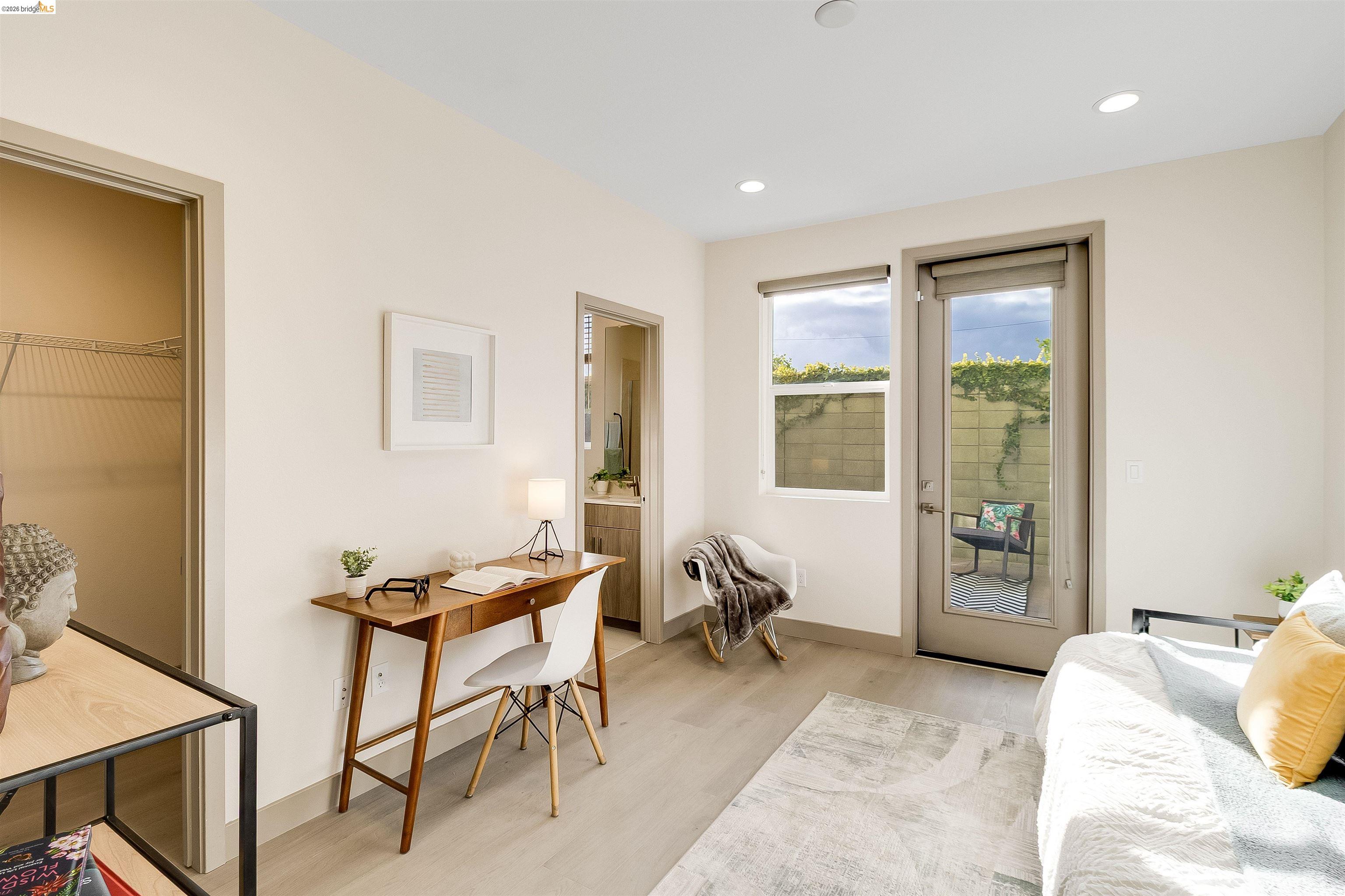 1357 Pullman Way Oakland, CA 94607 - Photo 5 of 37 Versatile room featuring wood-finish flooring, recessed lighting, and a glass-paneled door leading to an outdoor patio