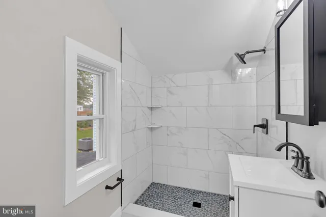 a view of livingroom with washer and dryer