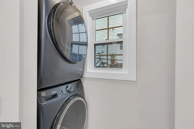 a room with cabinets and white appliances