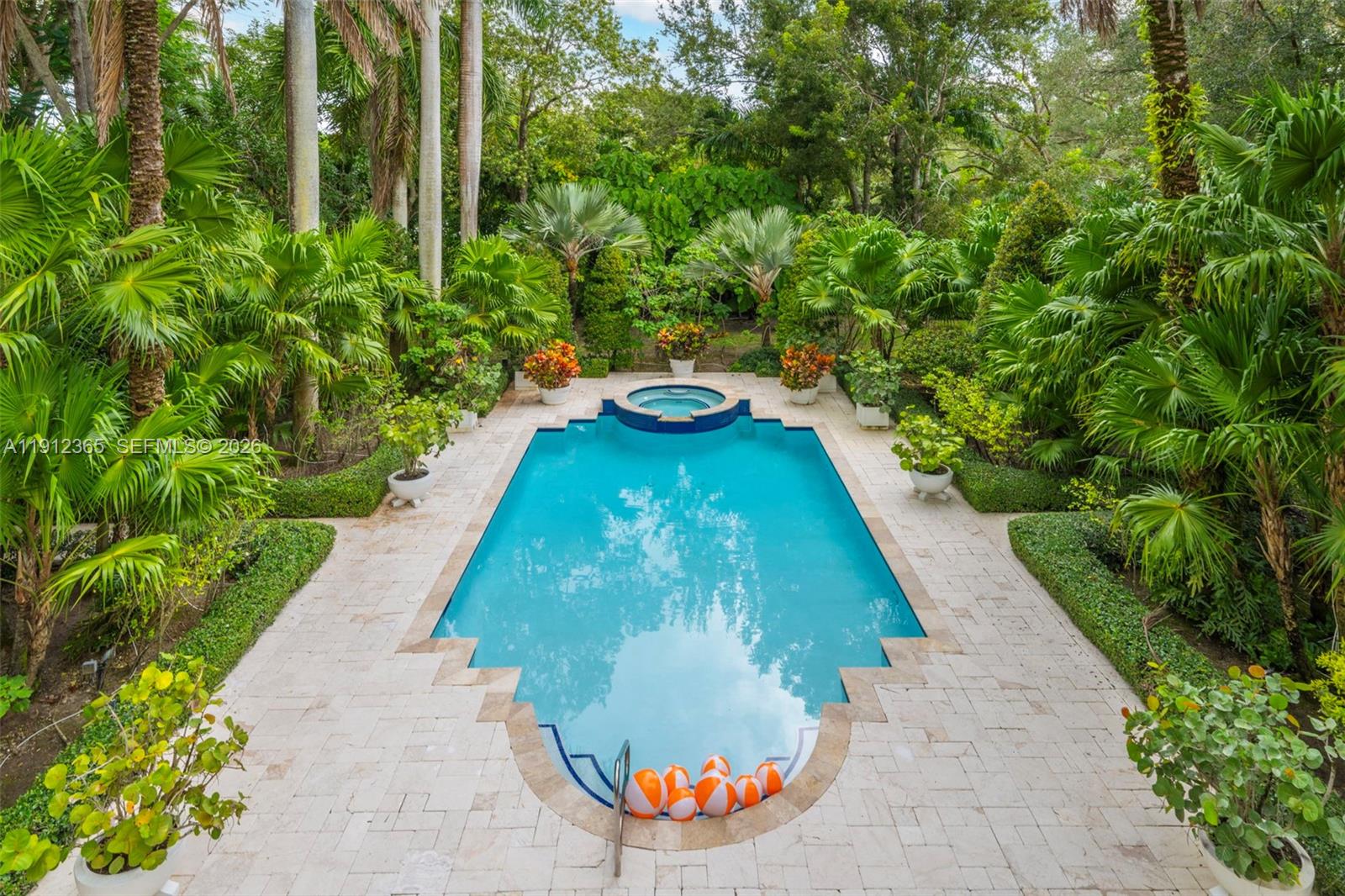 a view of a swimming pool with a yard
