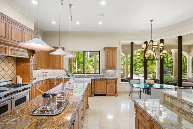 a large kitchen with a table and chairs