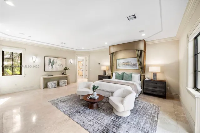 a spacious bathroom with a double vanity sink a large mirror and a bathtub