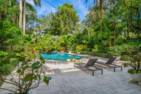 a view of a backyard with sitting area