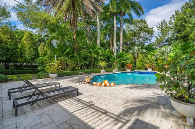 a view of swimming pool with a yard
