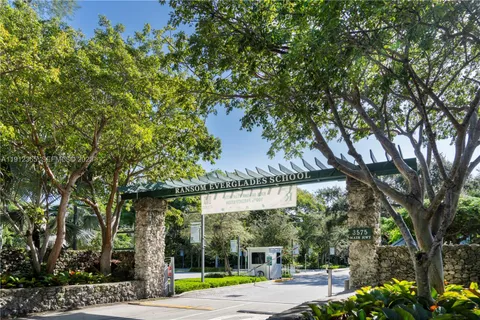 a view of a swimming pool with an outdoor seating space