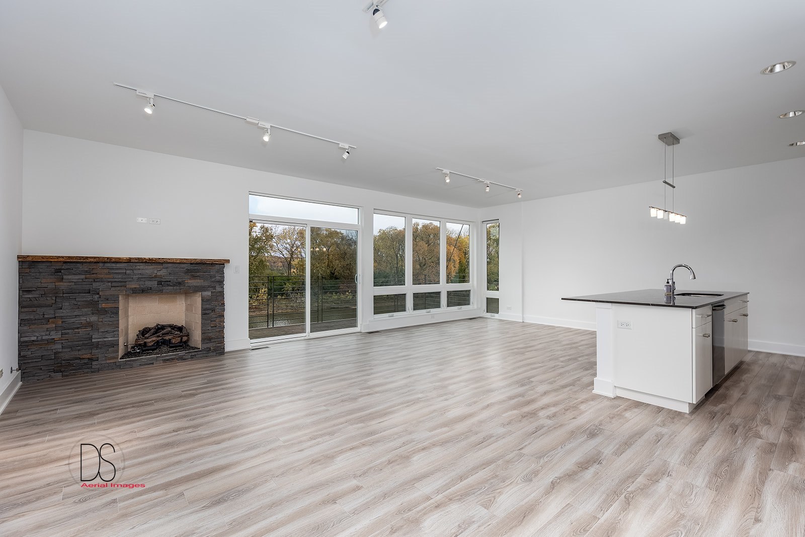 45 Windward Way Ottawa, IL 61350 - Photo 14 of 29 a view of an empty room with wooden floor and a fireplace