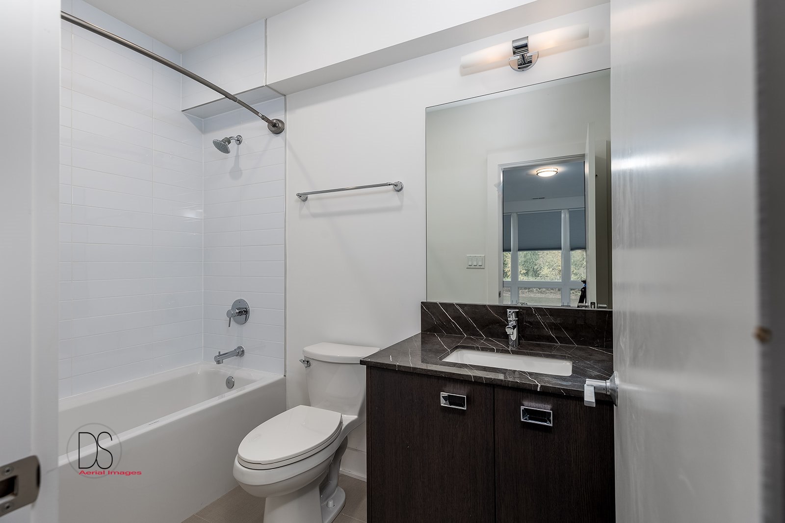 45 Windward Way Ottawa, IL 61350 - Photo 27 of 29 a bathroom with a granite countertop sink a toilet a mirror and shower