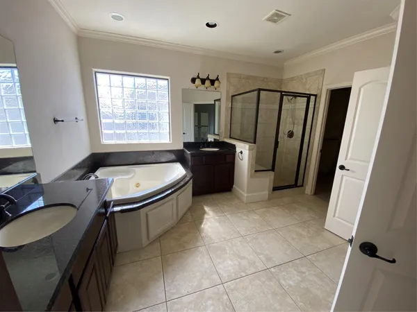 a bathroom with a tub toilet and sink