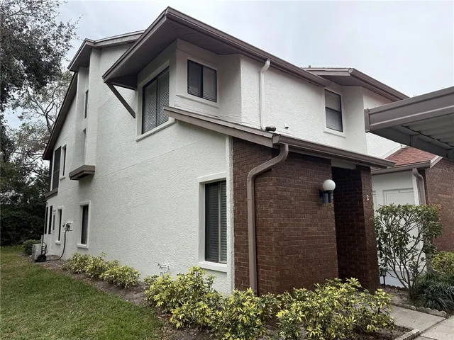 a house with trees in front of it