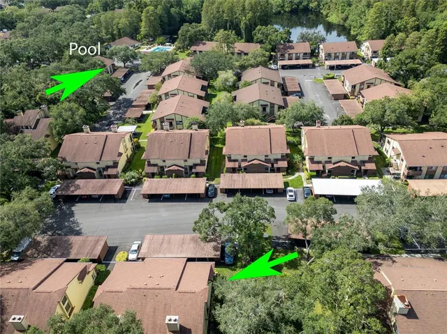an aerial view of residential houses with outdoor space