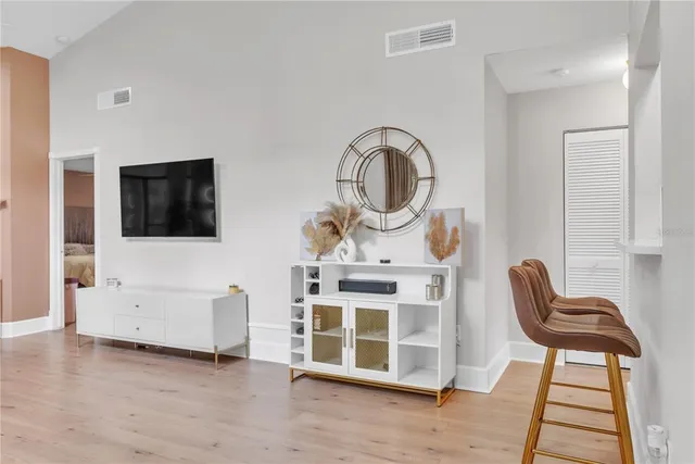 a view of a livingroom with furniture and a flat screen tv