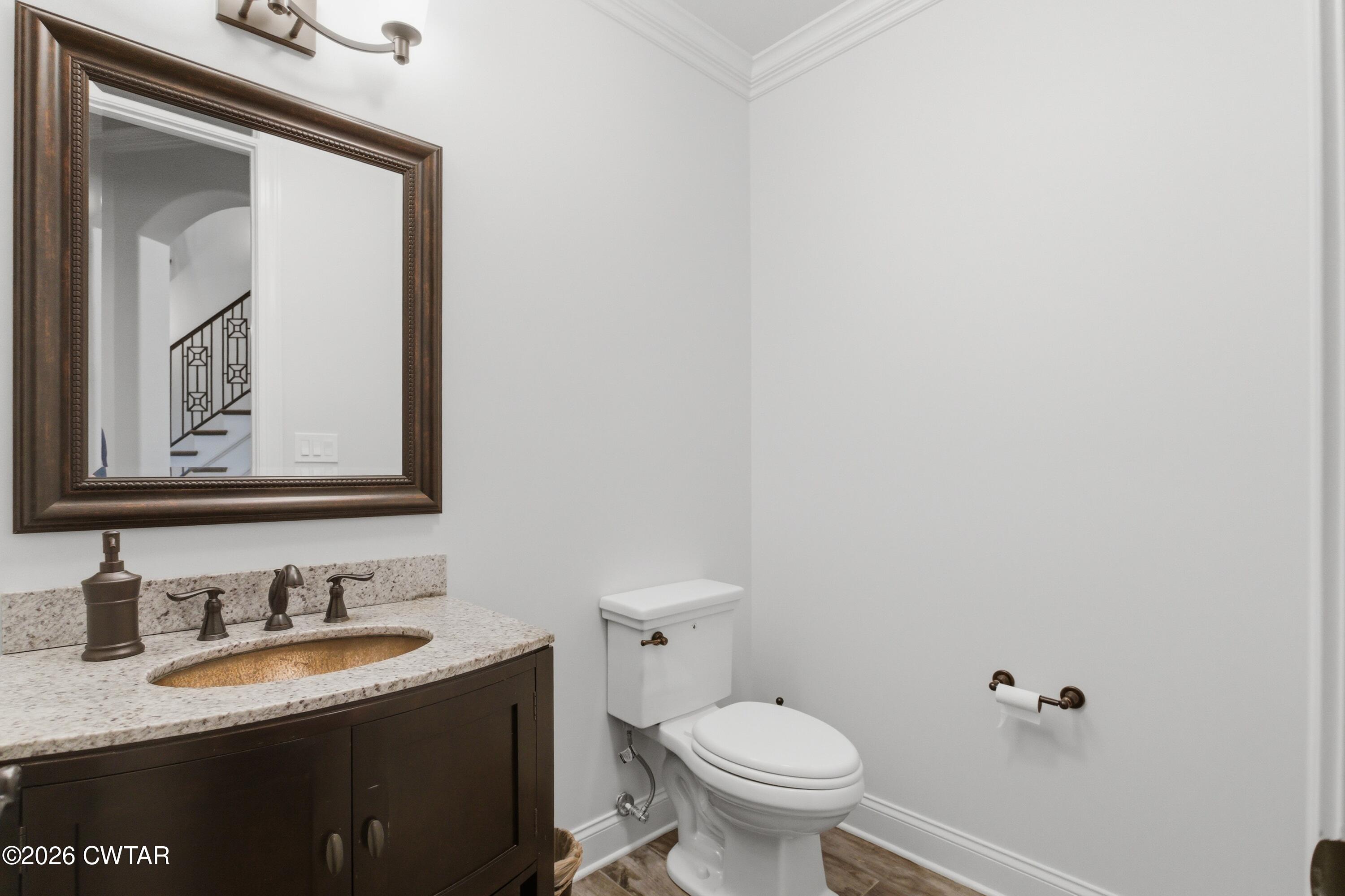963 Ashport Road Jackson, TN 38305 - Photo 21 of 60 a bathroom with a granite countertop sink mirror and toilet