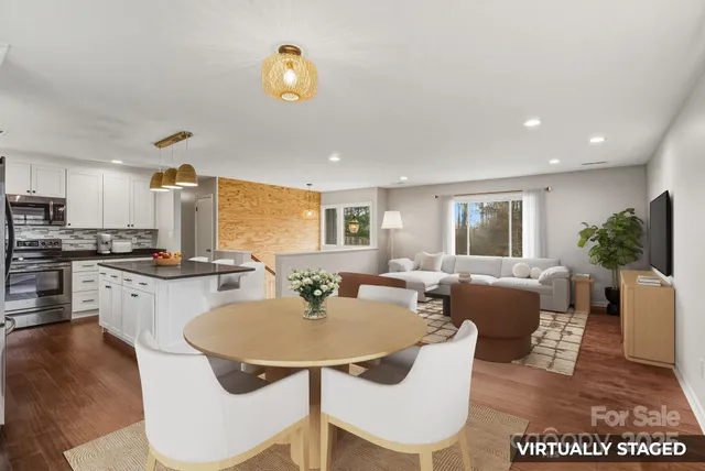 a kitchen with a dining table and chairs