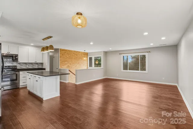 a view of kitchen with microwave and stove