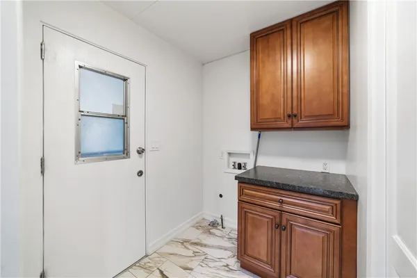 a kitchen with granite countertop cabinets stainless steel appliances granite countertop cabinets and a granite counter tops