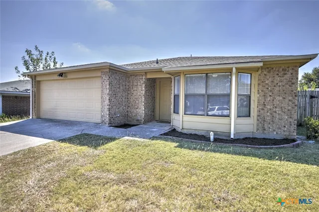 a front view of a house with a garage
