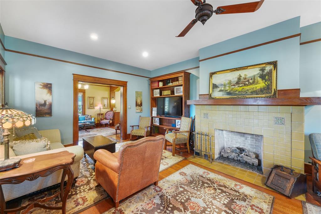 406 Griffith Avenue Terrell, TX 75160 - Photo 12 of 40 a living room with furniture a rug and a fireplace