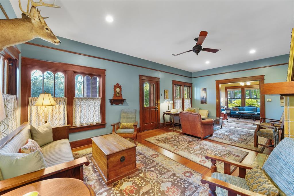 406 Griffith Avenue Terrell, TX 75160 - Photo 13 of 40 a living room with furniture ceiling fan and a rug