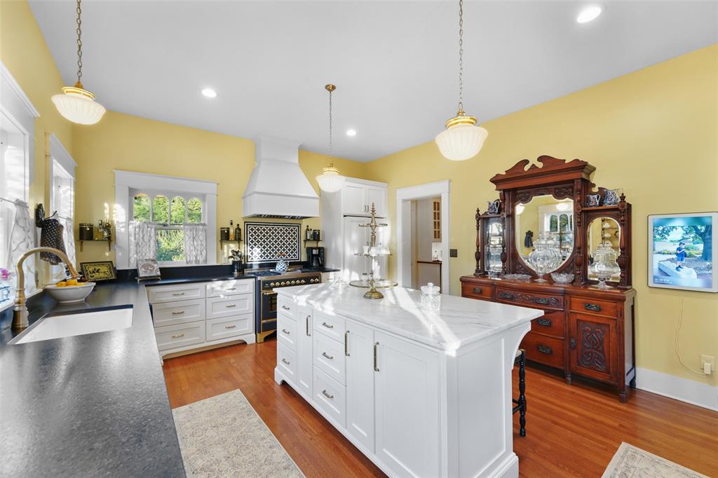 406 Griffith Avenue Terrell, TX 75160 - Photo 14 of 40 a kitchen with sink stove and wooden floor