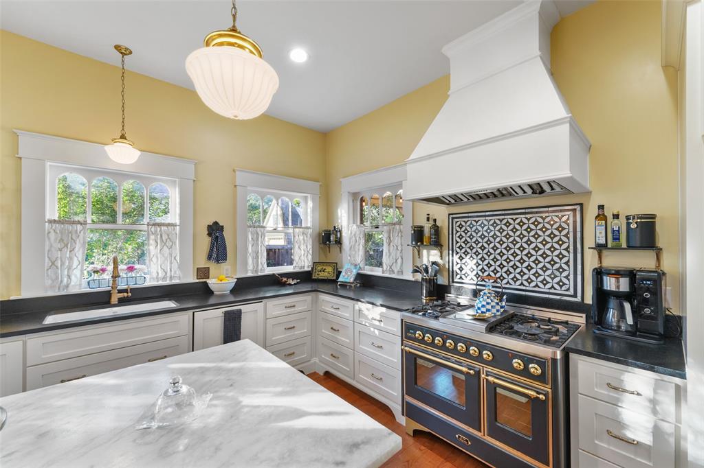 406 Griffith Avenue Terrell, TX 75160 - Photo 15 of 40 a kitchen with a stove and a sink