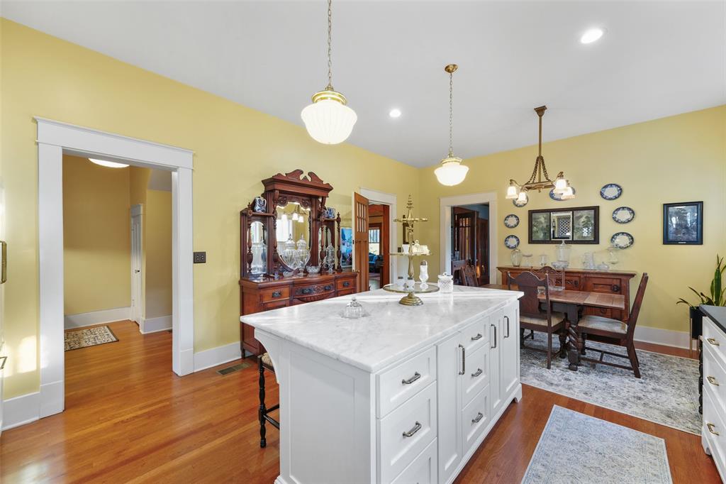 406 Griffith Avenue Terrell, TX 75160 - Photo 17 of 40 a kitchen that has a lot of cabinets in it