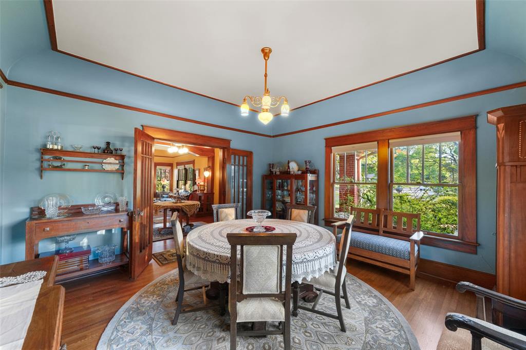 406 Griffith Avenue Terrell, TX 75160 - Photo 20 of 40 a dining room with furniture a chandelier and a rug
