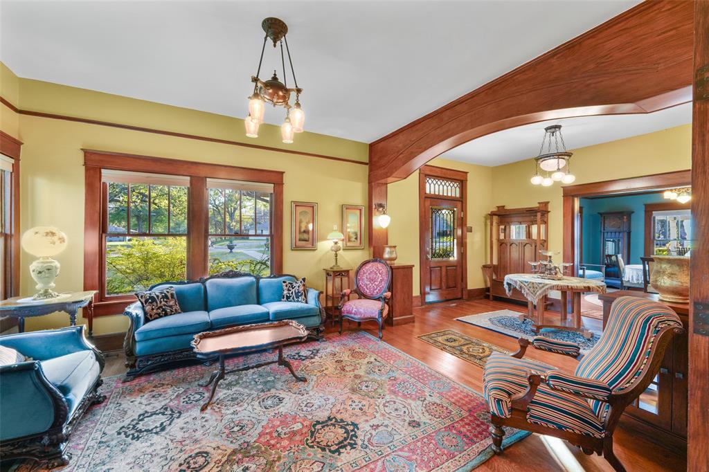 406 Griffith Avenue Terrell, TX 75160 - Photo 25 of 40 a living room with furniture a rug and a chandelier