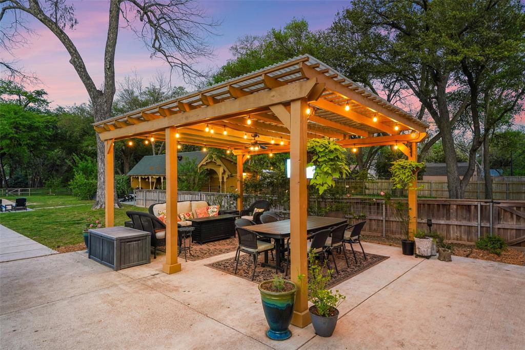 406 Griffith Avenue Terrell, TX 75160 - Photo 3 of 40 a view of a patio with a table chairs and a backyard