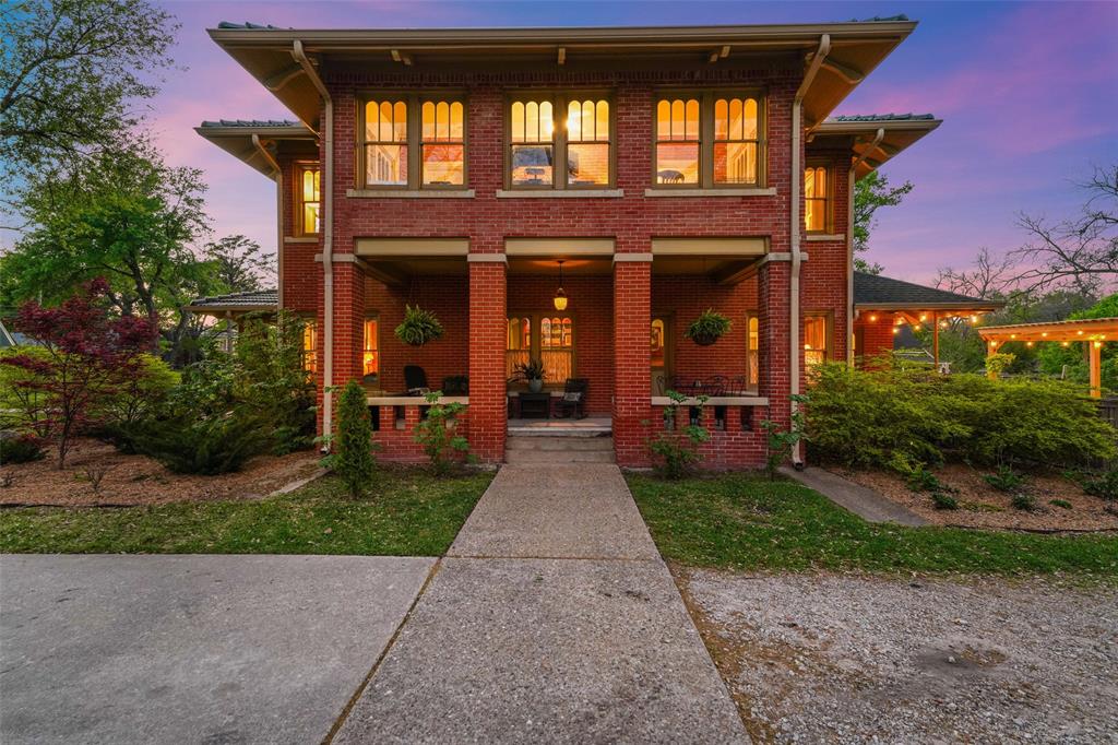 406 Griffith Avenue Terrell, TX 75160 - Photo 7 of 40 front view of a brick house with a yard