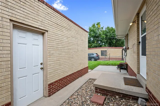a view of a backyard with sitting area
