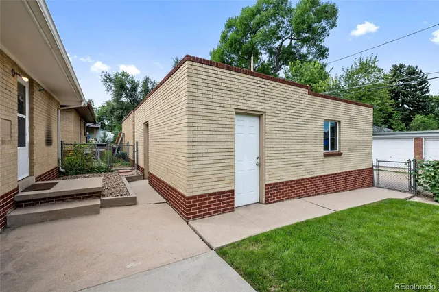 a view of backyard with patio