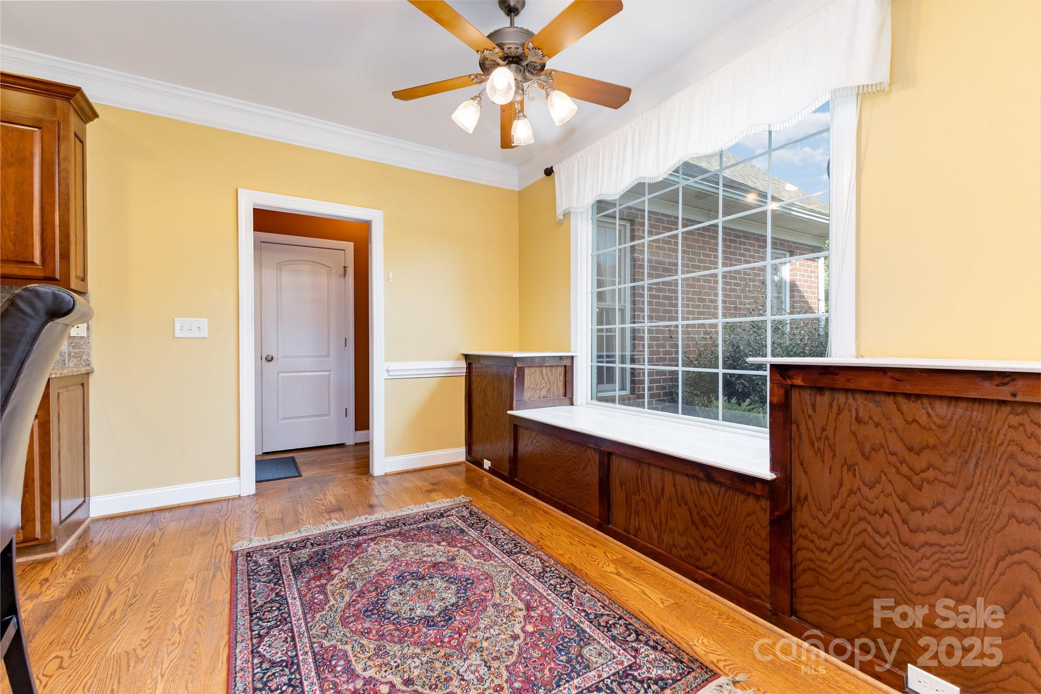 2227 Nash Road Wingate, NC 28174 - Photo 11 of 40 a view of workspace with wooden floor and fan