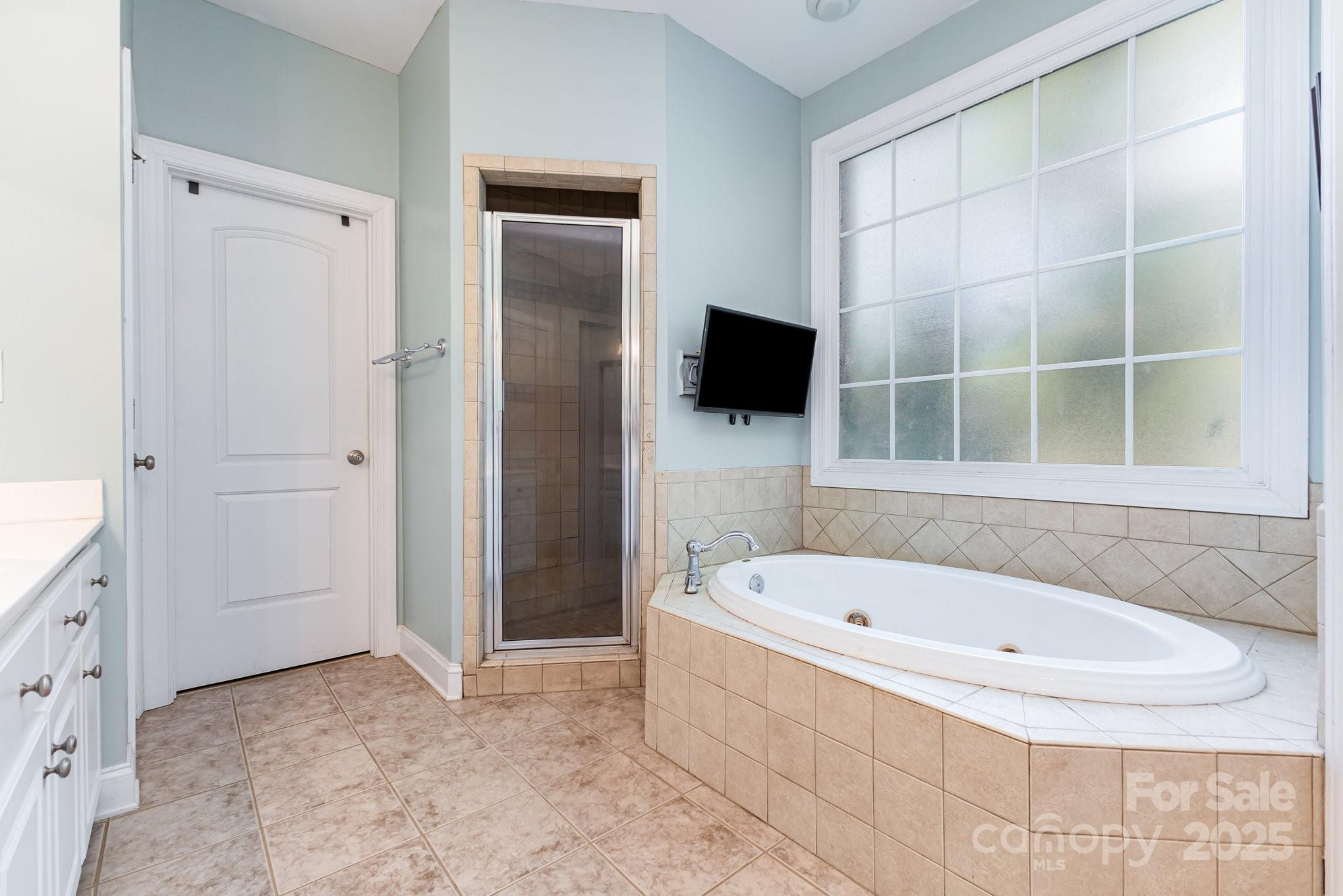2227 Nash Road Wingate, NC 28174 - Photo 19 of 40 a white bath tub sitting next to a bathroom sink