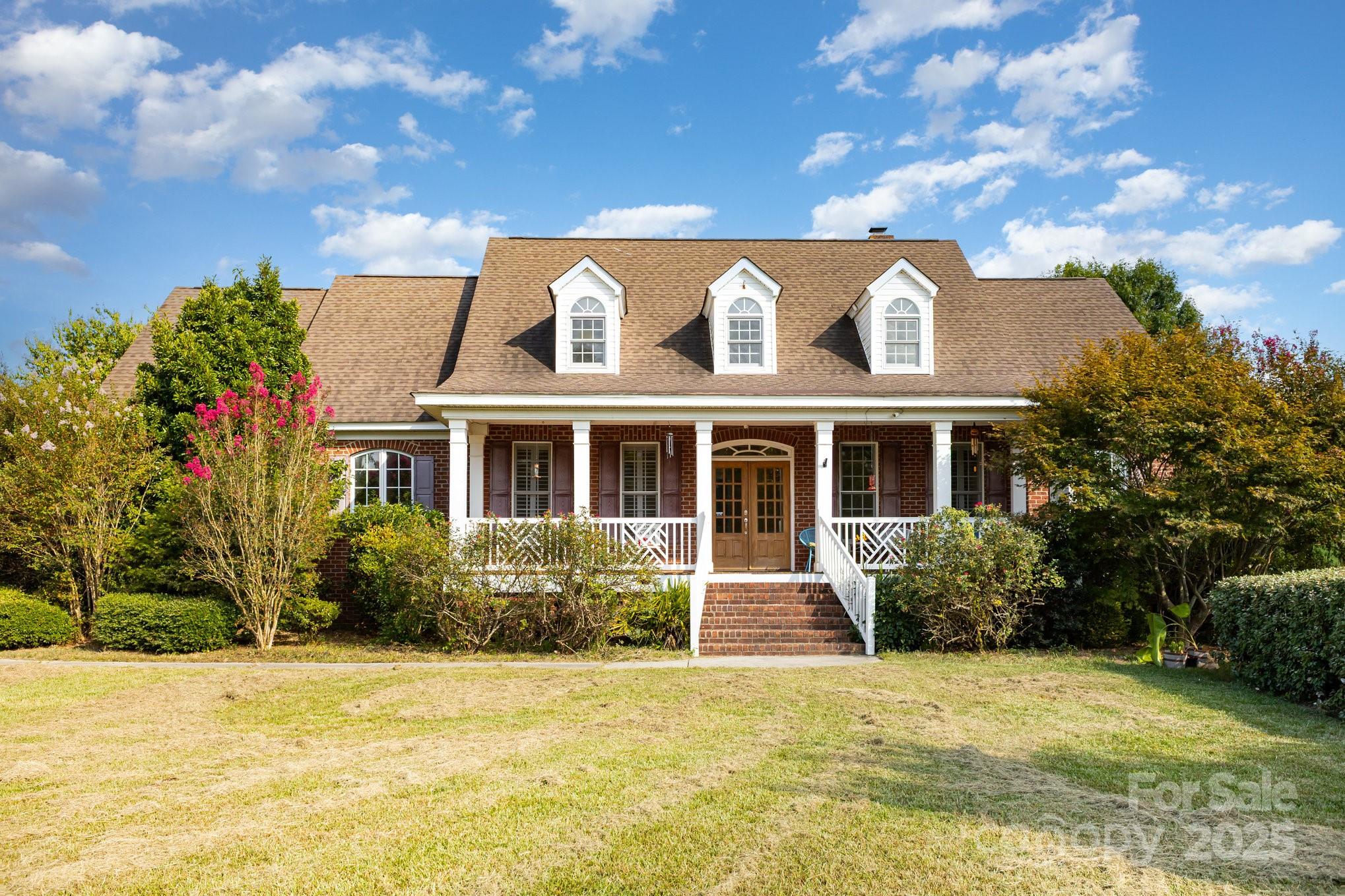 2227 Nash Road Wingate, NC 28174 - Photo 2 of 40 a view of a house with garden space
