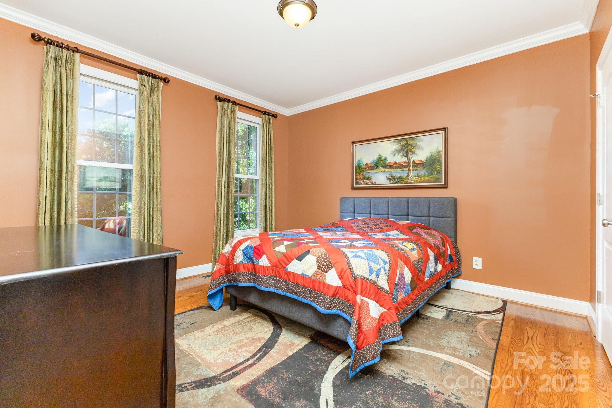 2227 Nash Road Wingate, NC 28174 - Photo 21 of 40 a bed sitting in a bedroom next to a window